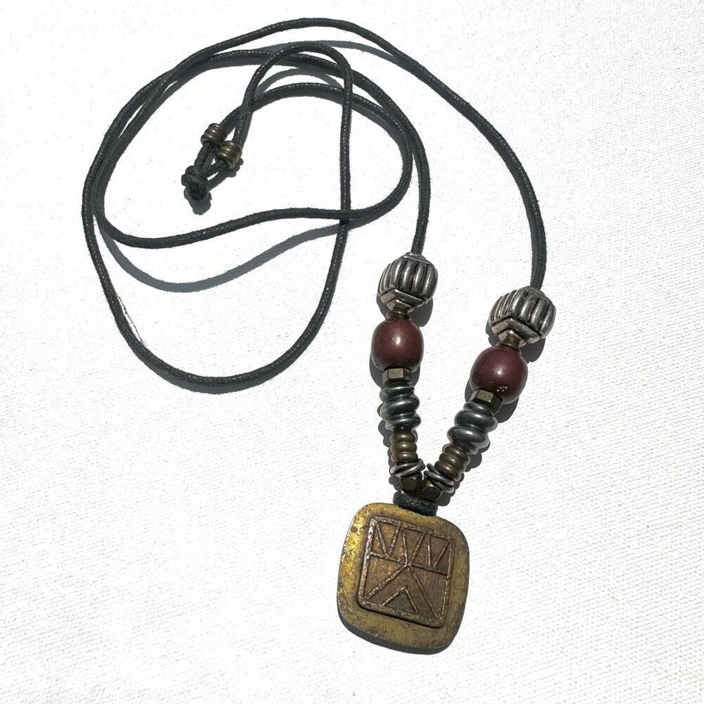 Baer SF sterling silver and brass pendant necklace on black cord